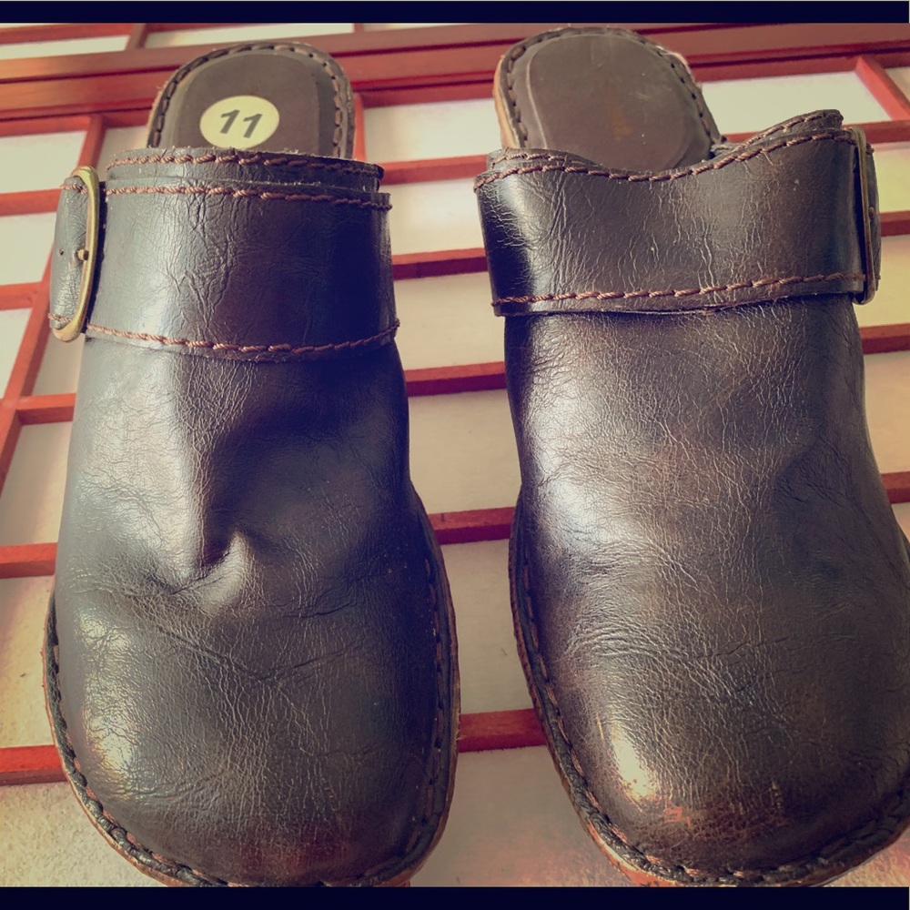 Brown buckled clogs